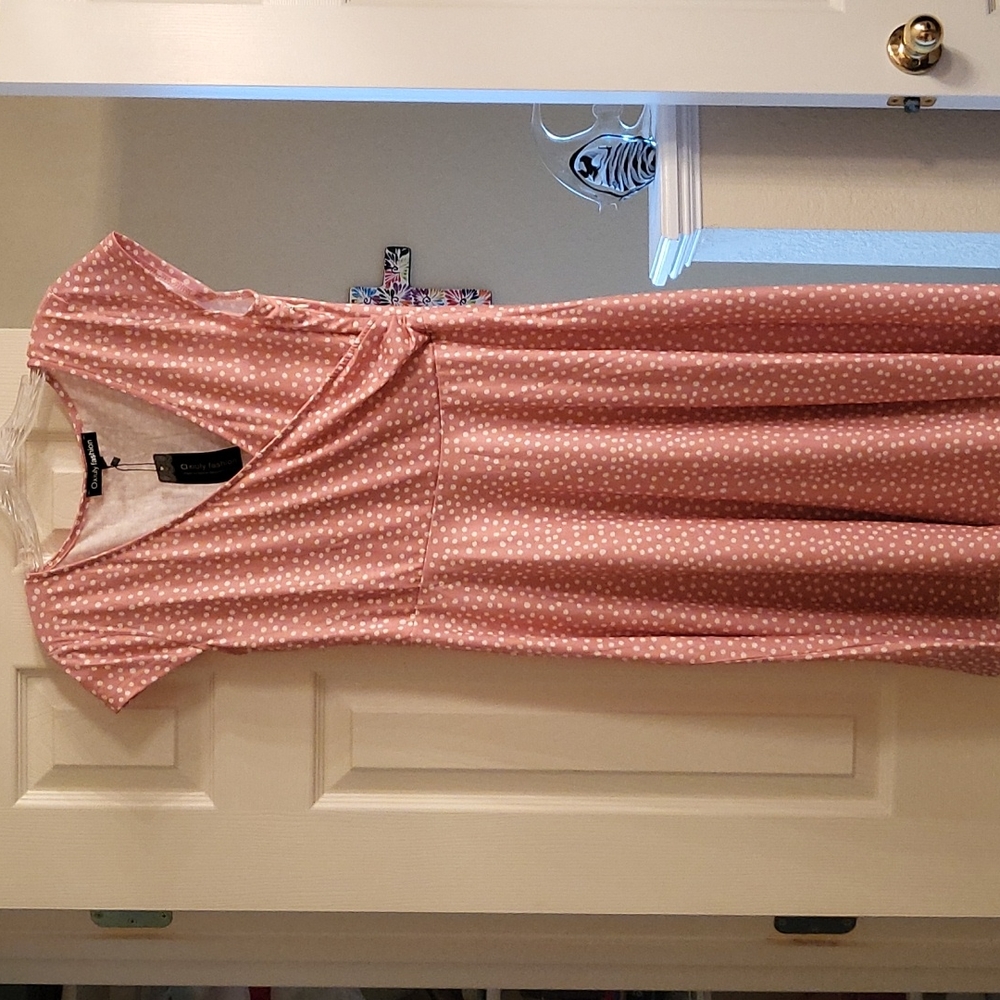 Womens light pink and white polka dot dress. Never worn still has tags